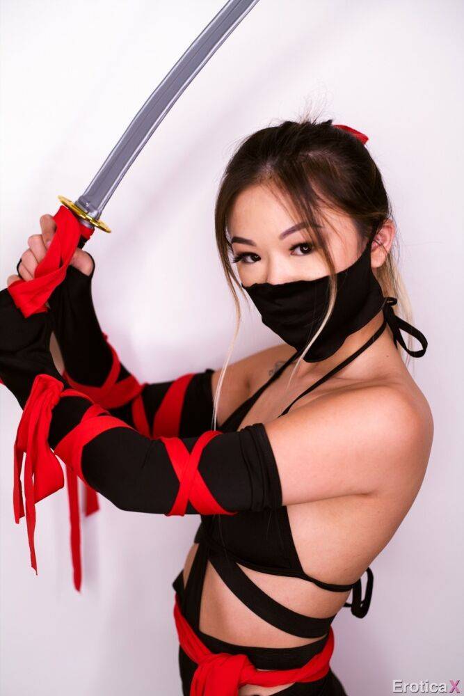 Petite Asian teen Lulu Chu wields a samurai sword before fucking - #15