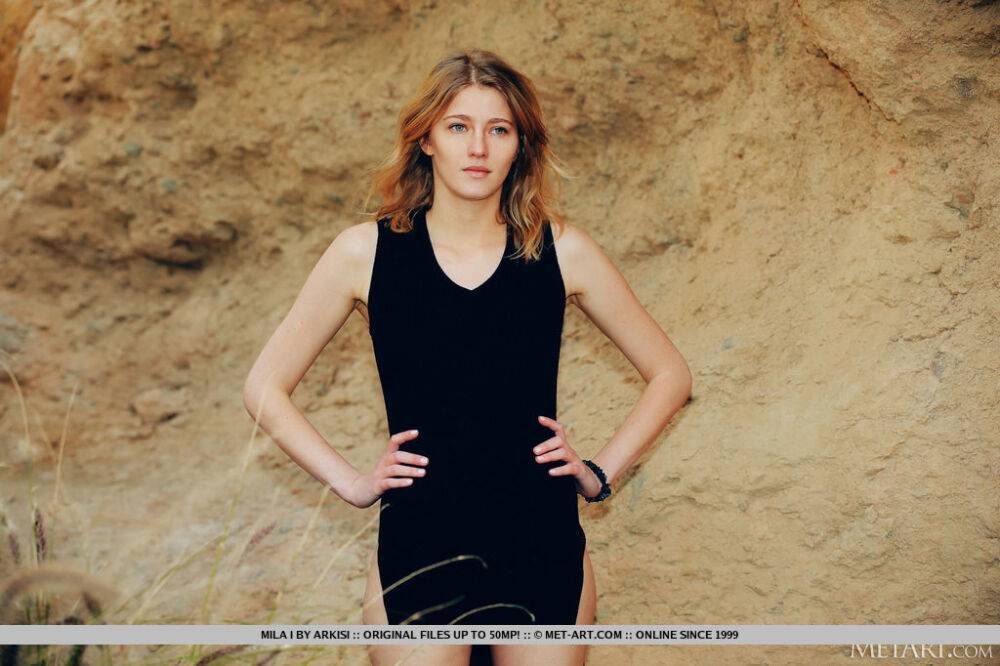 Barefoot teen Mila I doffs a black dress to pose totally naked on a boulder - #10