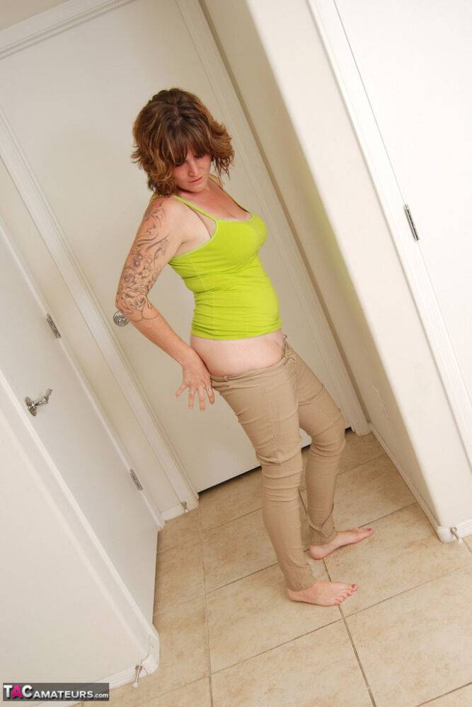 Tattooed amateur Misty B gets dressed after a nude modeling gig is over - #12