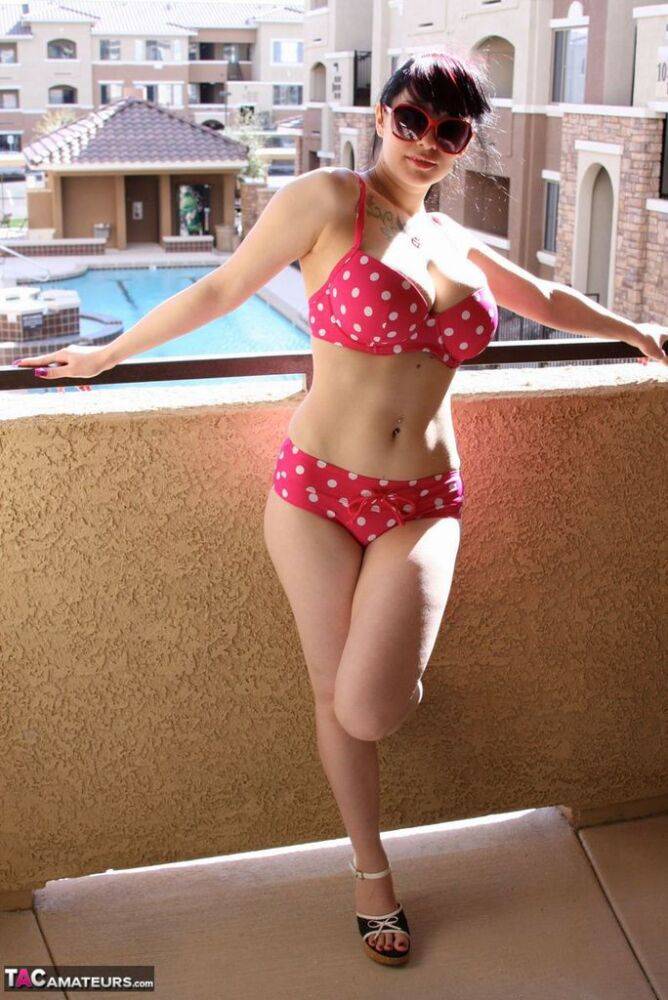 Amateur girl Susy Rocks models a polka-dot bikini in shades on a balcony - #5