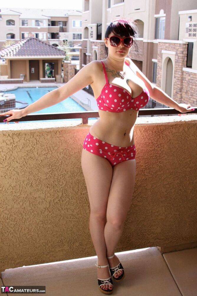 Amateur girl Susy Rocks models a polka-dot bikini in shades on a balcony - #6