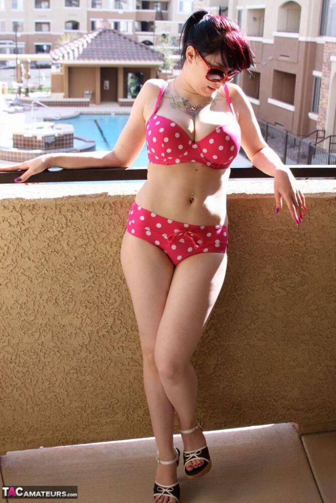Amateur girl Susy Rocks models a polka-dot bikini in shades on a balcony - #8