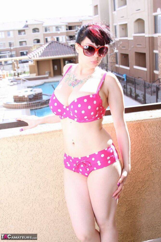 Amateur girl Susy Rocks models a polka-dot bikini in shades on a balcony - #16
