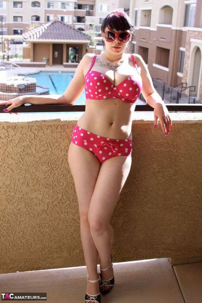 Amateur girl Susy Rocks models a polka-dot bikini in shades on a balcony - #1