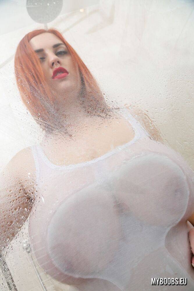 Sexy redhead Alexsis Faye presses her hooters up against a glass shower wall - #12