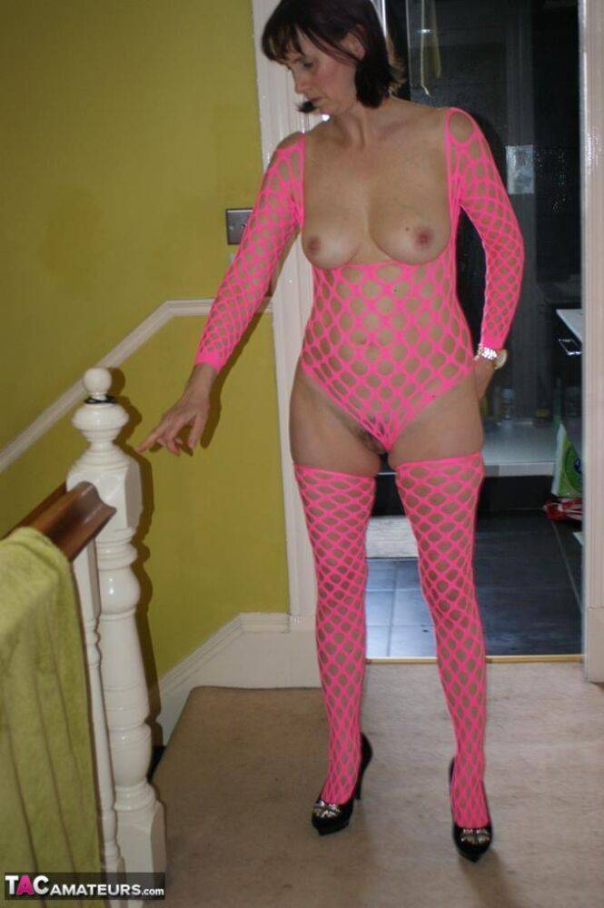 Older amateur Slut Scot Susan dildos her cunt while wearing pink mesh attire - #9
