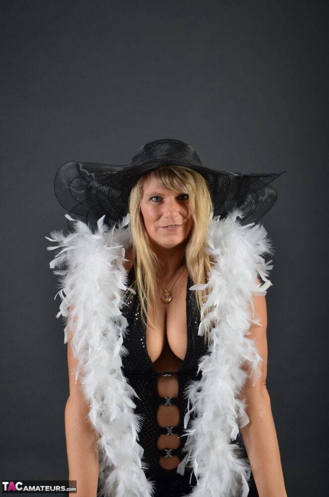 Middle-aged blonde Sweet Susi displays her tits and ass while in a big hat - #13