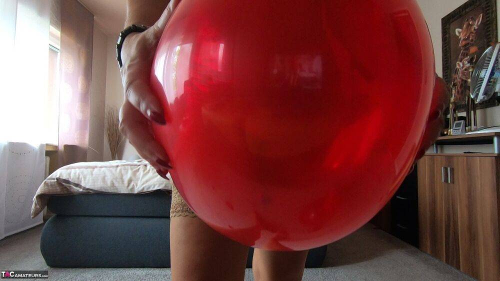 Middle-aged blonde Sweet Susi exposes her tits while playing with balloons - #8