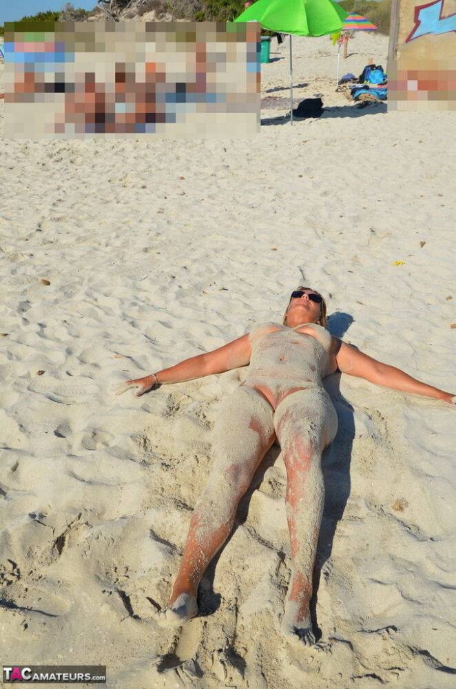Naked amateur Sweet Susi covers her body in beach sand in sunglasses - #16