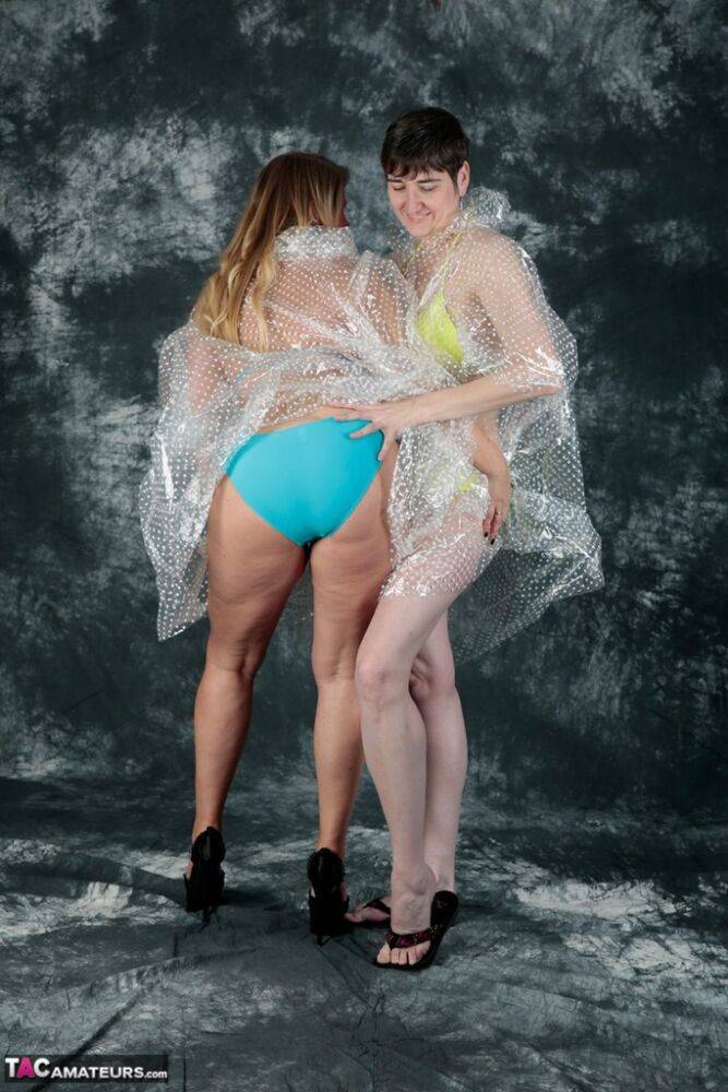Blonde amateur Sweet Susi and her lesbian lover hump each other in raincoats - #9