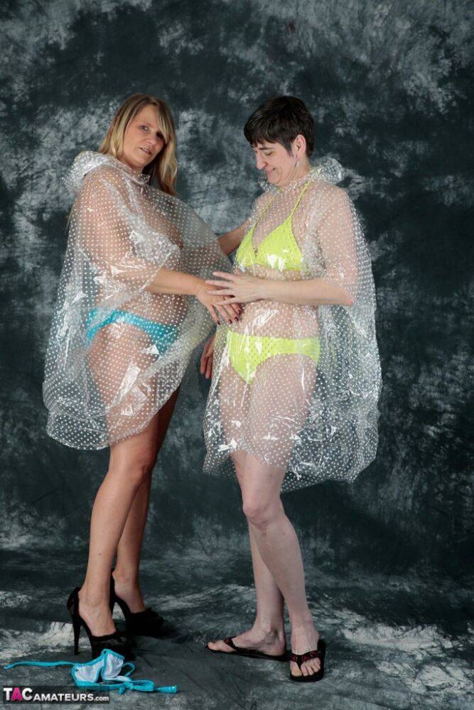 Blonde amateur Sweet Susi and her lesbian lover hump each other in raincoats - #11