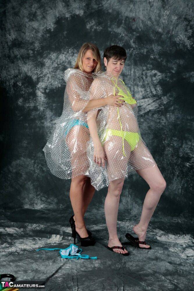 Blonde amateur Sweet Susi and her lesbian lover hump each other in raincoats - #7