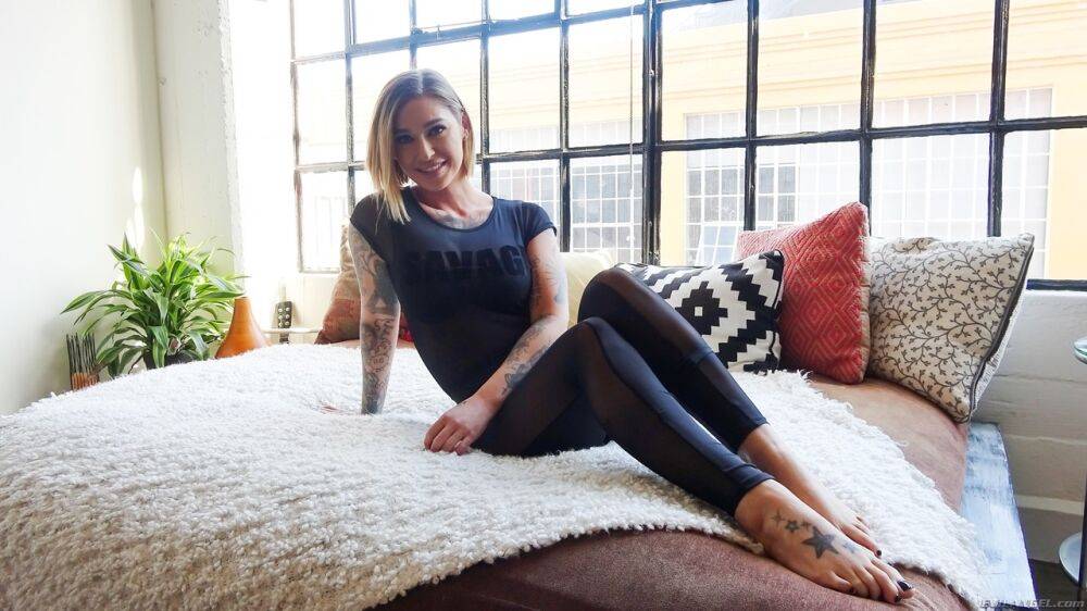 Tattooed girl Kleio Valentien bares round tits as she gets naked on bed | Photo: 1337235