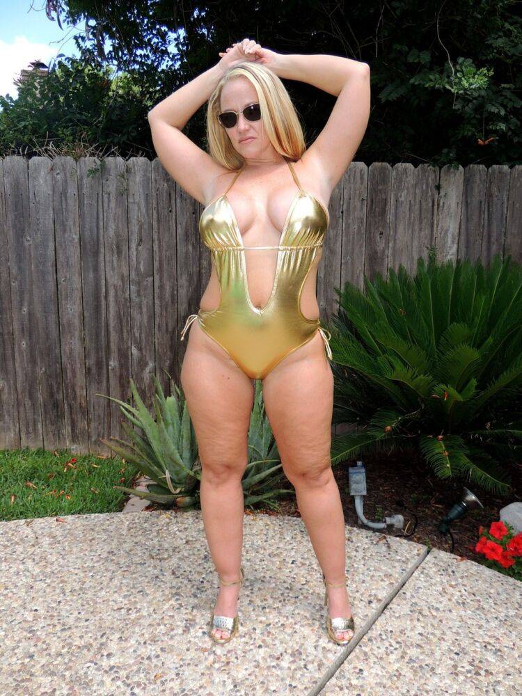 Blonde chick Dee Siren shows her big ass in gold swimsuit and sunglasses - #14