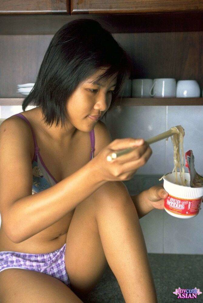 Cute Asian girl shows the pink of her pussy after eating noodles - #13