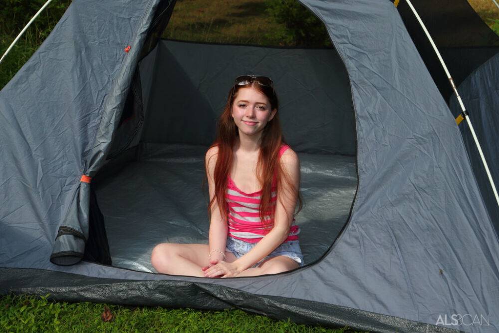 Young looking girl Myra Glasford dildos her pink pussy outside her tent - #12