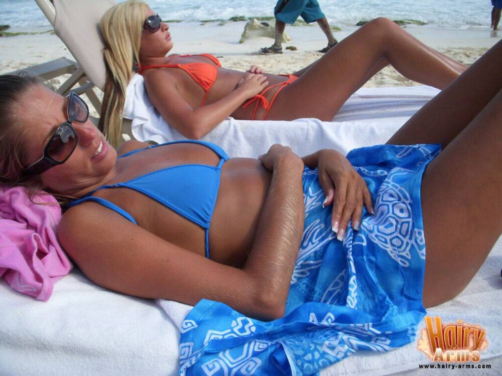 Hirsute blonde Lori Anderson relaxes on a beach in her bikini and sunglasses - #7