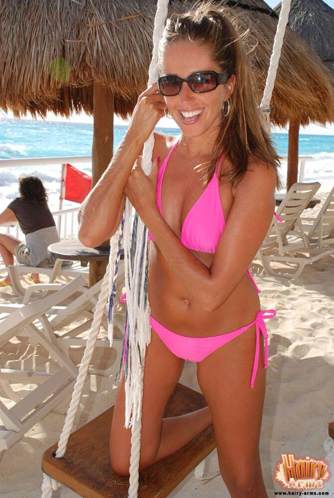 Amateur model Lori Anderson shows her hairy arms in a bikini and sunglasses - #13