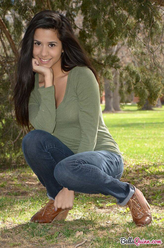 Latina chick Bella Quinn climbs a tree in the park wearing a sweater and jeans - #12