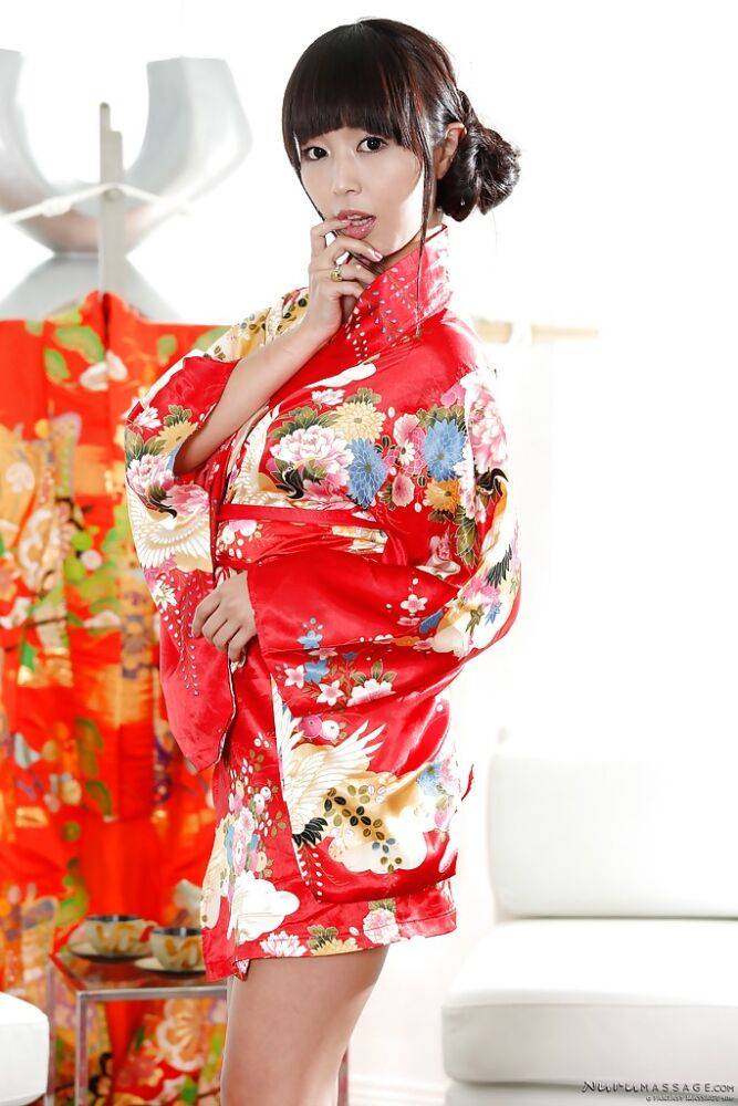 Japanese babe Marica Hase does a slow striptease out of Geisha uniform - #10