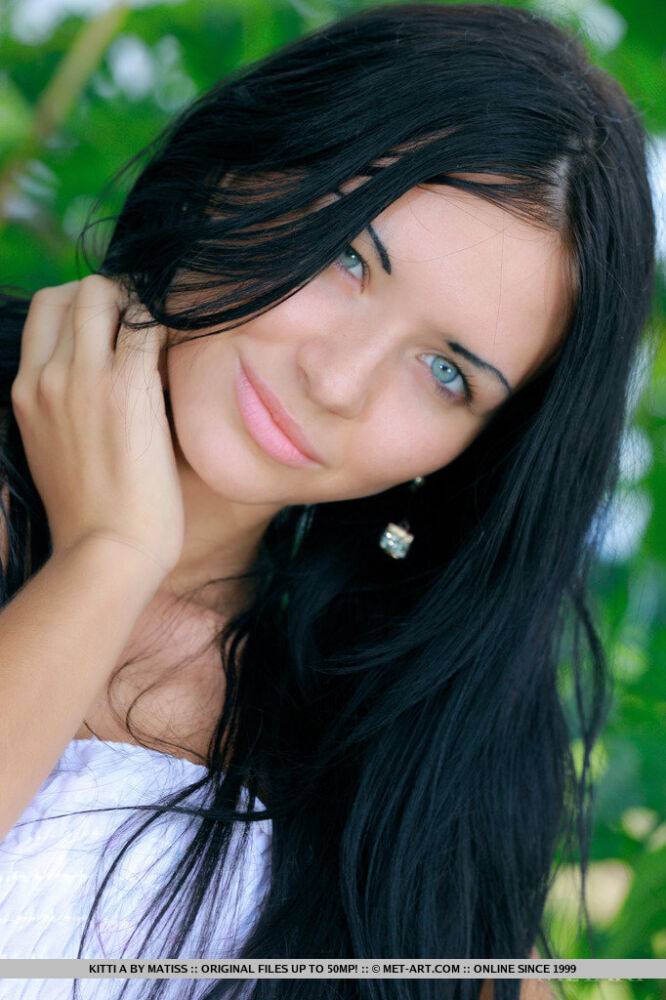 Dark haired Russian teen Kitti A strips totally naked under a tree - #8