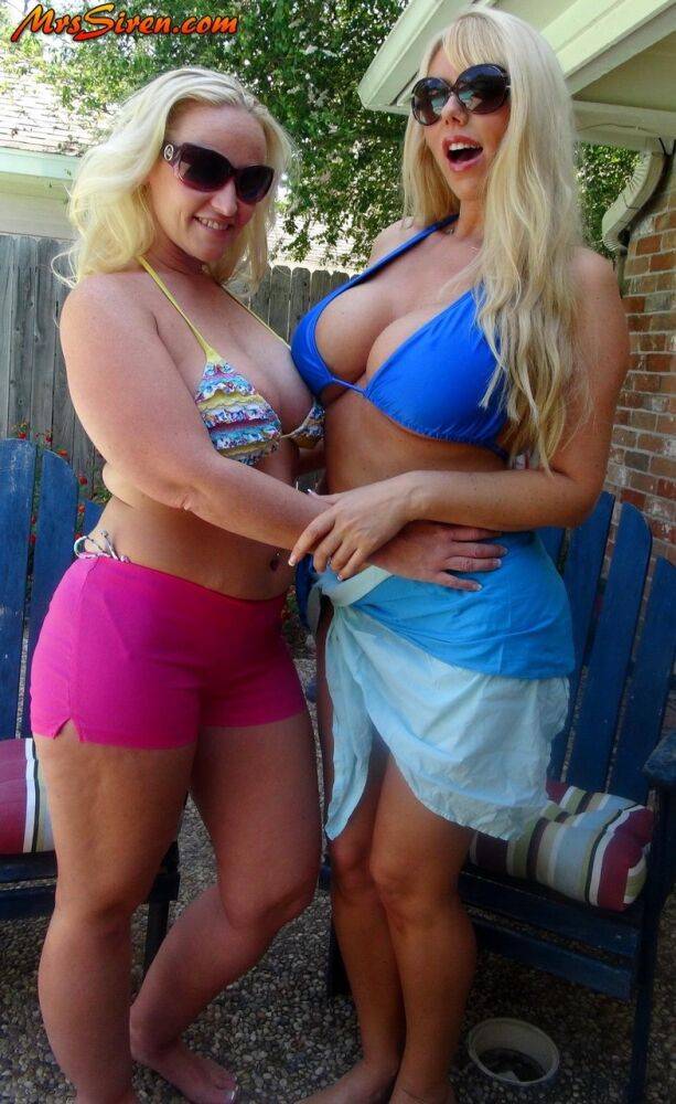 Blonde women Karen Fisher and Dee Siren loose their big tits from bikini tops - #7