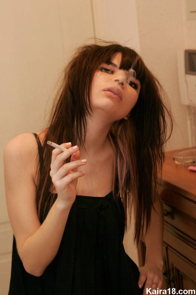 Petite teen Kaira 18 lights up a cigarette before getting totally naked - #11