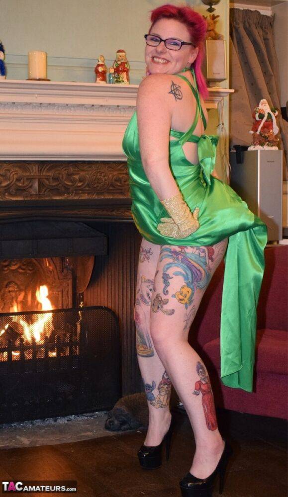 Tattooed amateur Mollie Foxxx exposes herself afore a fireplace in a dress - #12
