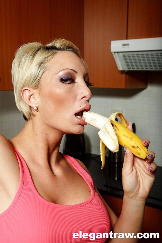 Tight pornstar Pearl Diamond eating a banana and posing naked in a kitchen - #14
