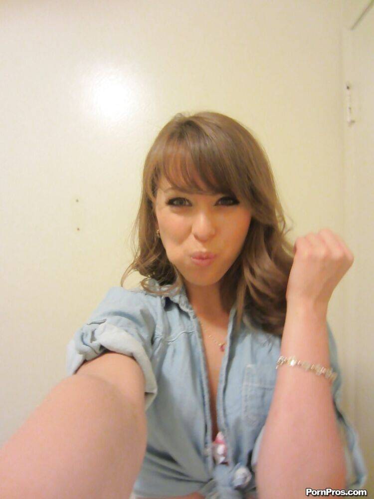 Clothed teen Riley Reid does some sexy self shots while in a toilet - #12