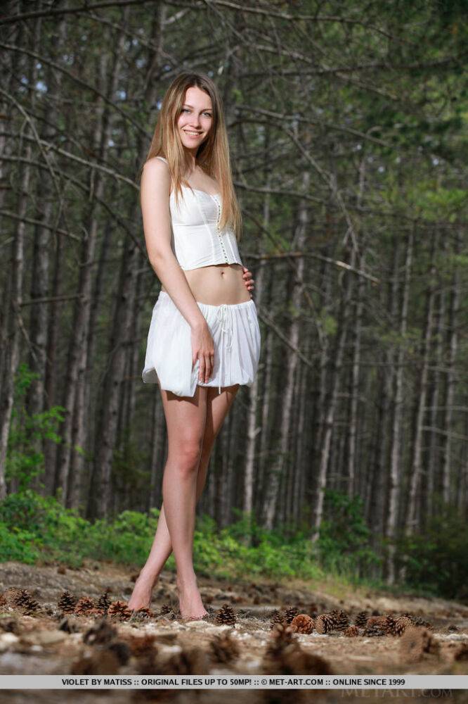 Russian college girl Violet disrobes for a nude solo shoot in a forest - #16