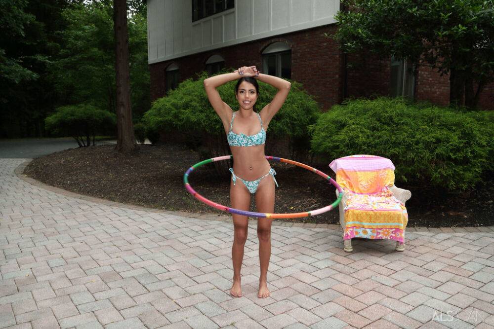 Young amateur Rachel Rivers works a hula hoop while getting naked on a patio - #12