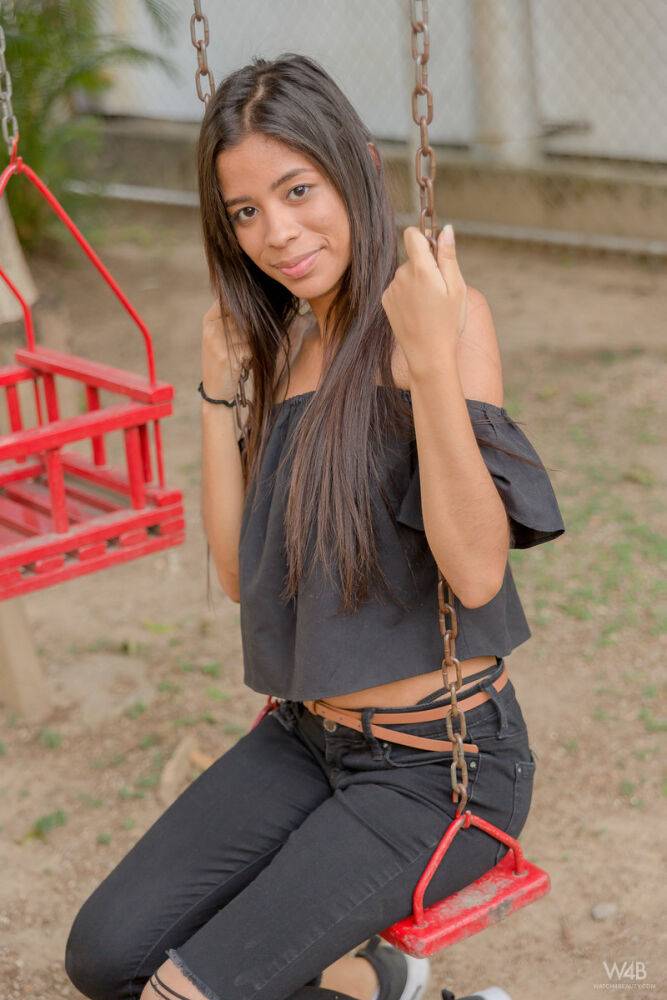 Smiley hot glamour girl Karin Torres looking sexy in ripped jeans on a swing - #10