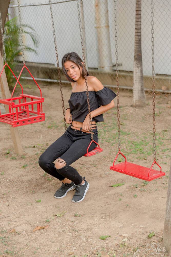 Smiley hot glamour girl Karin Torres looking sexy in ripped jeans on a swing - #15