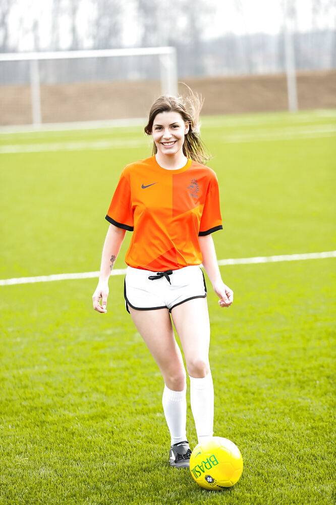 Lilly P is undressing her soccer uniform while on the field with a ball - #6