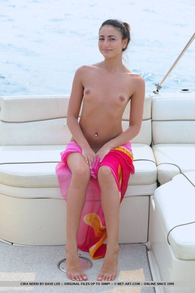 Teen solo girl Cira Nerri proudly shows her tiny tits and tight slit on a boat - #10