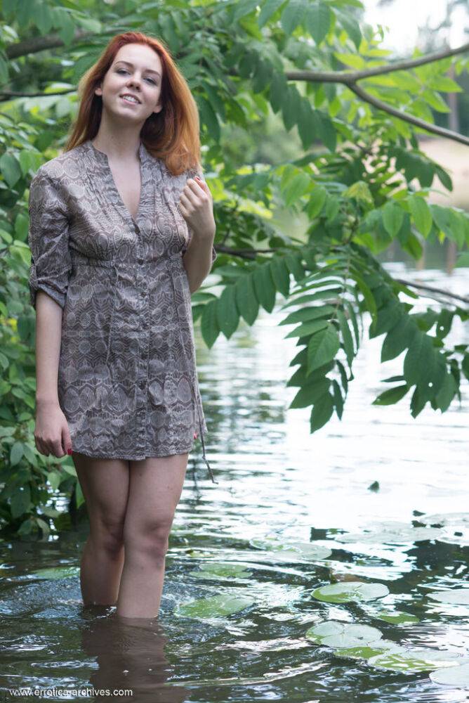 Pale redhead Candy Red slips off a dress to go naked in and out of a stream - #12