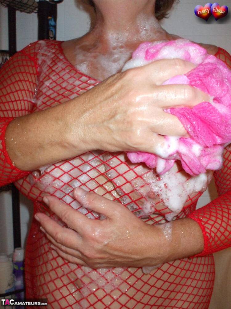 Older amateur Busty Bliss soaps up her boobs in a mesh dress - #1