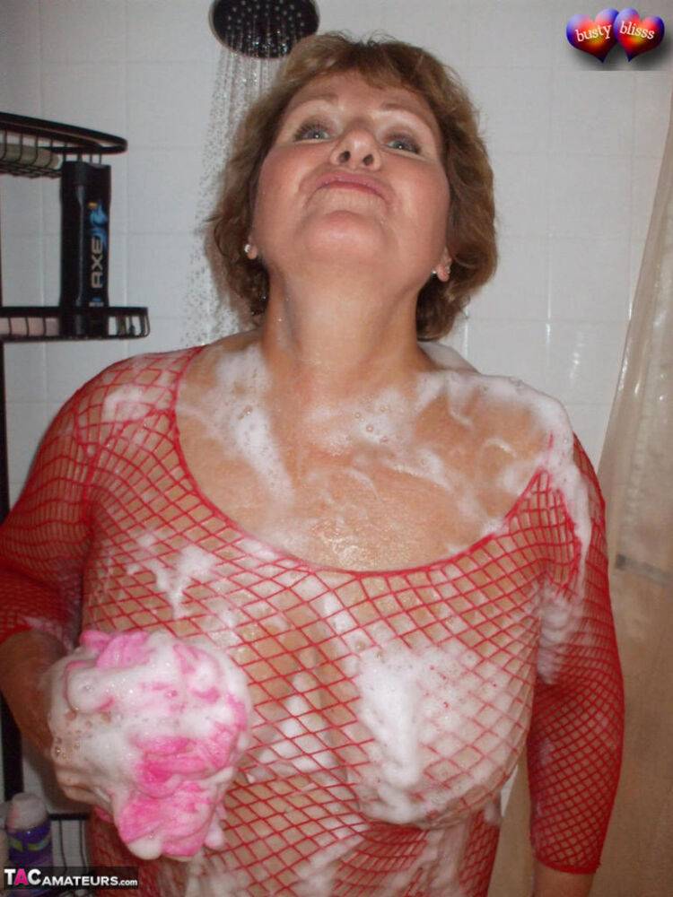 Older amateur Busty Bliss soaps up her boobs in a mesh dress - #16