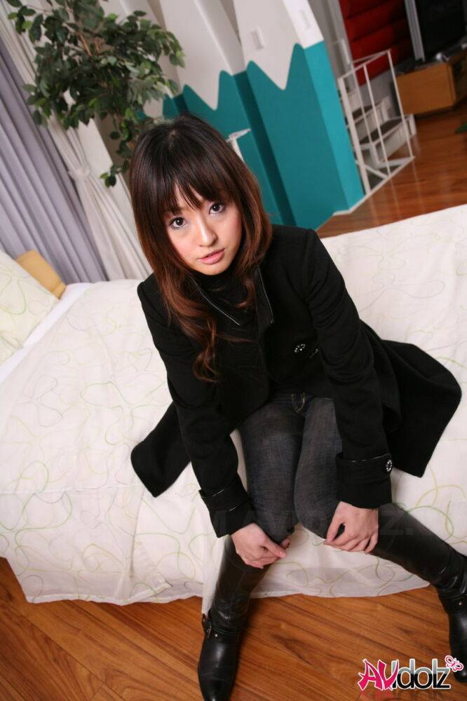 Japanese girl with a pretty face models non nude in a black coat and jeans - #3