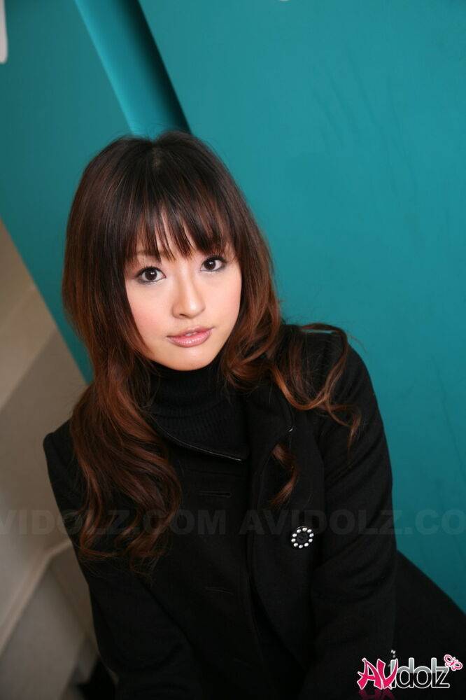 Japanese girl with a pretty face models non nude in a black coat and jeans - #15