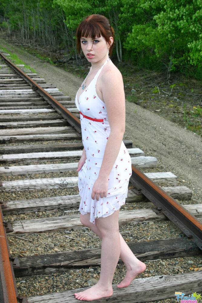 Redheaded girl Barbie A models a summer dress in bare feet on railway tracks - #7