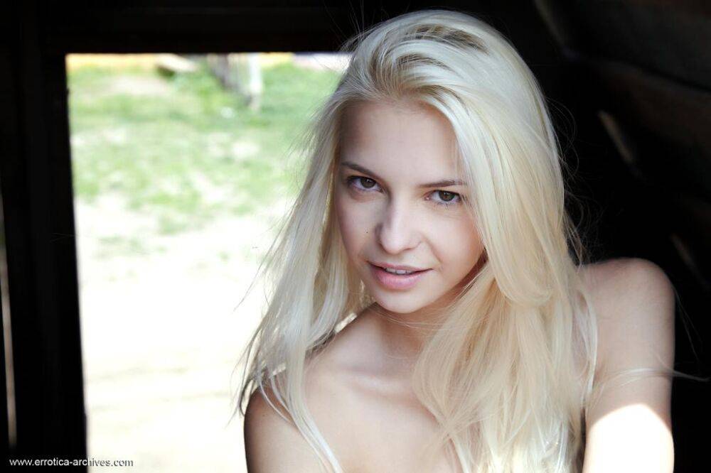 Blonde Russian girl Leonie models totally naked while in a barn - #14