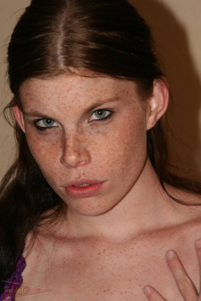 Redhead amateur with freckles displays her shaved vagina atop her bed - #13