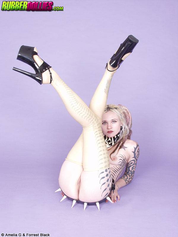 Tattooed blonde Voltaire Blue models naked in a spiky belt and heels - #7