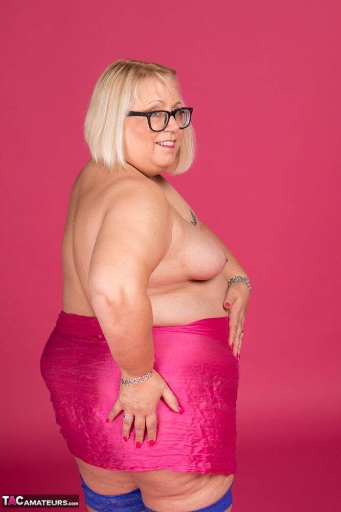 Blonde fatty Lexie Cummings models topless in glasses and stockings - #8