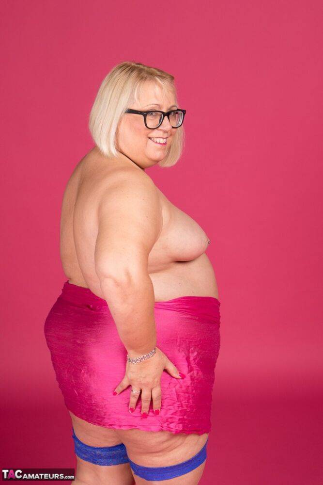 Blonde fatty Lexie Cummings models topless in glasses and stockings - #1
