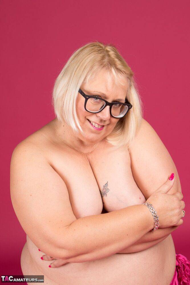 Blonde fatty Lexie Cummings models topless in glasses and stockings - #3