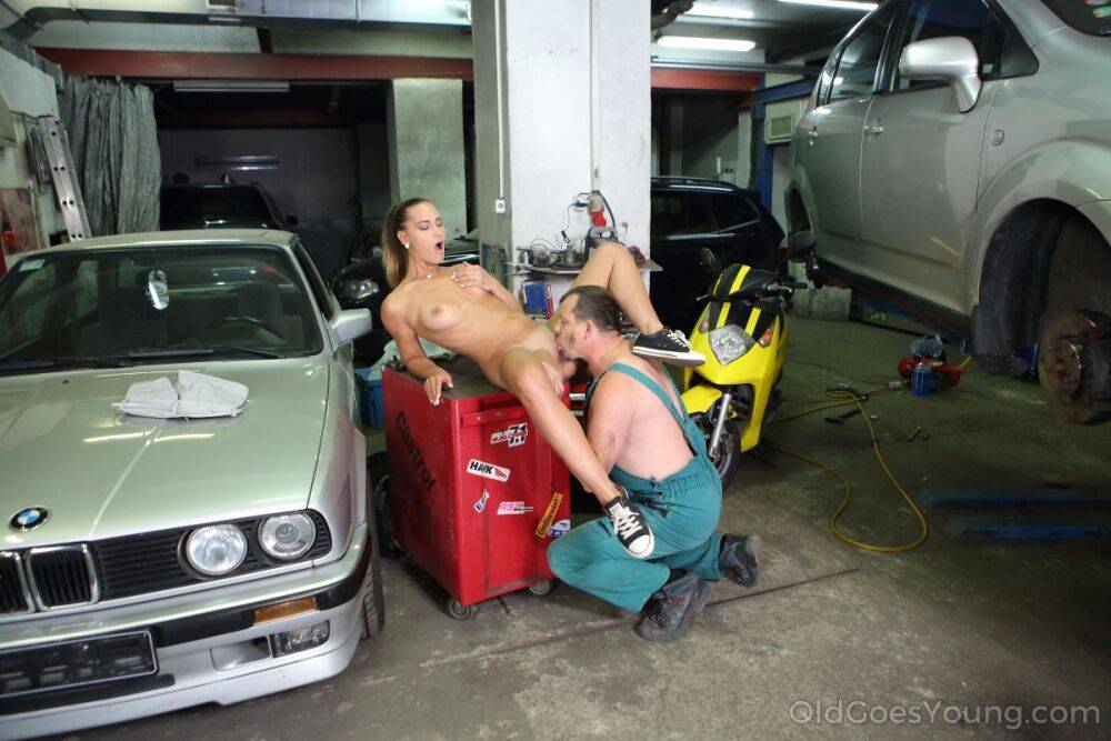 Horny teen Naomi Bennet seduces an old mechanic while he works on her car - #2