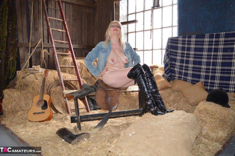 Blonde amateur Barby Slut gets naked in latex OTK boots inside a barn - #8